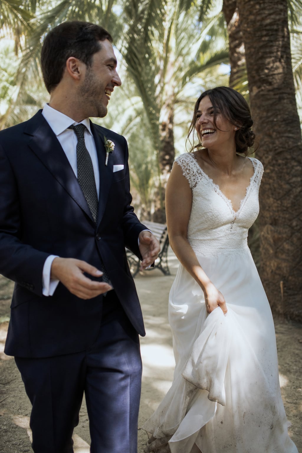 Bride and groom under the palm trees of Elche's Palmeral