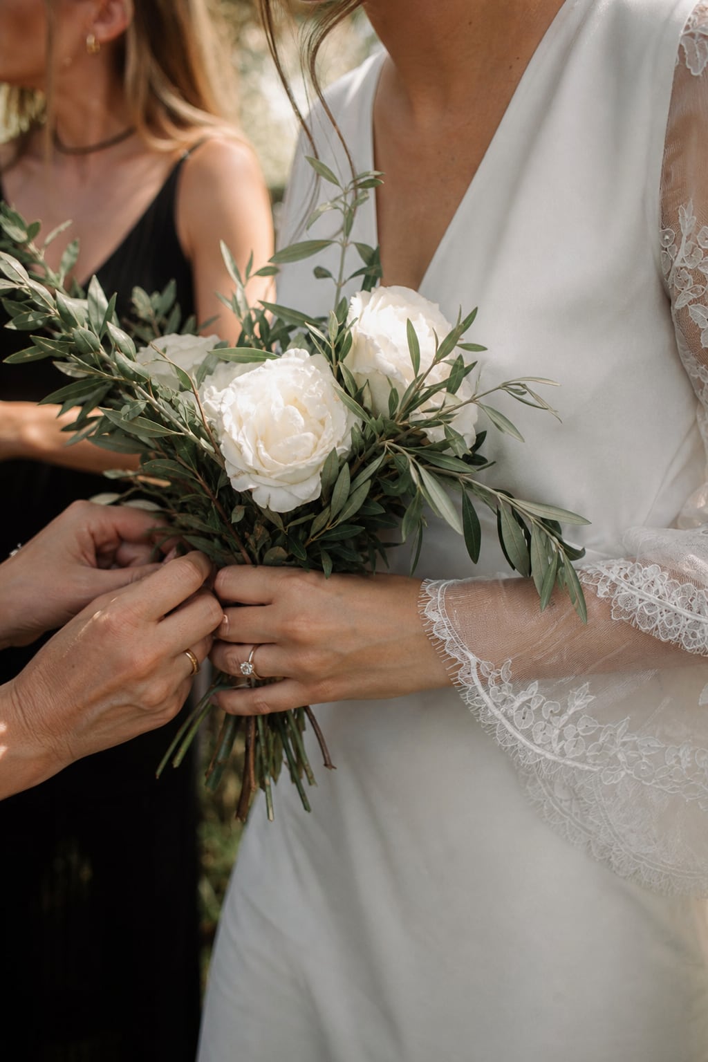 Bridal bouquet of white roses and olive branches